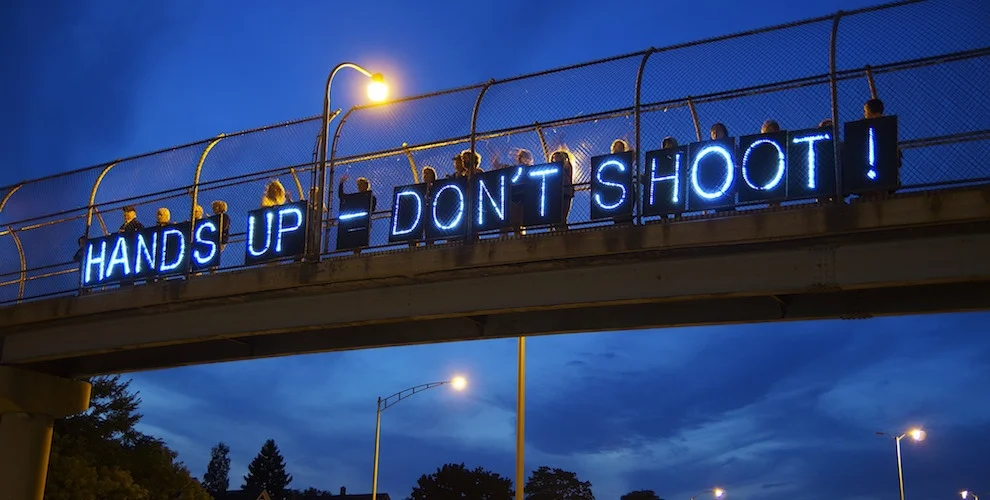 Protestors in St. Louis. "Hands Up - Don't Shoot!" is a common refrain. 