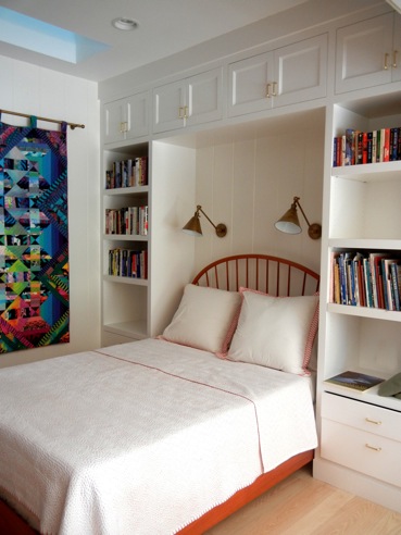 Custom spindle bed in the pool house, designed by IBID.