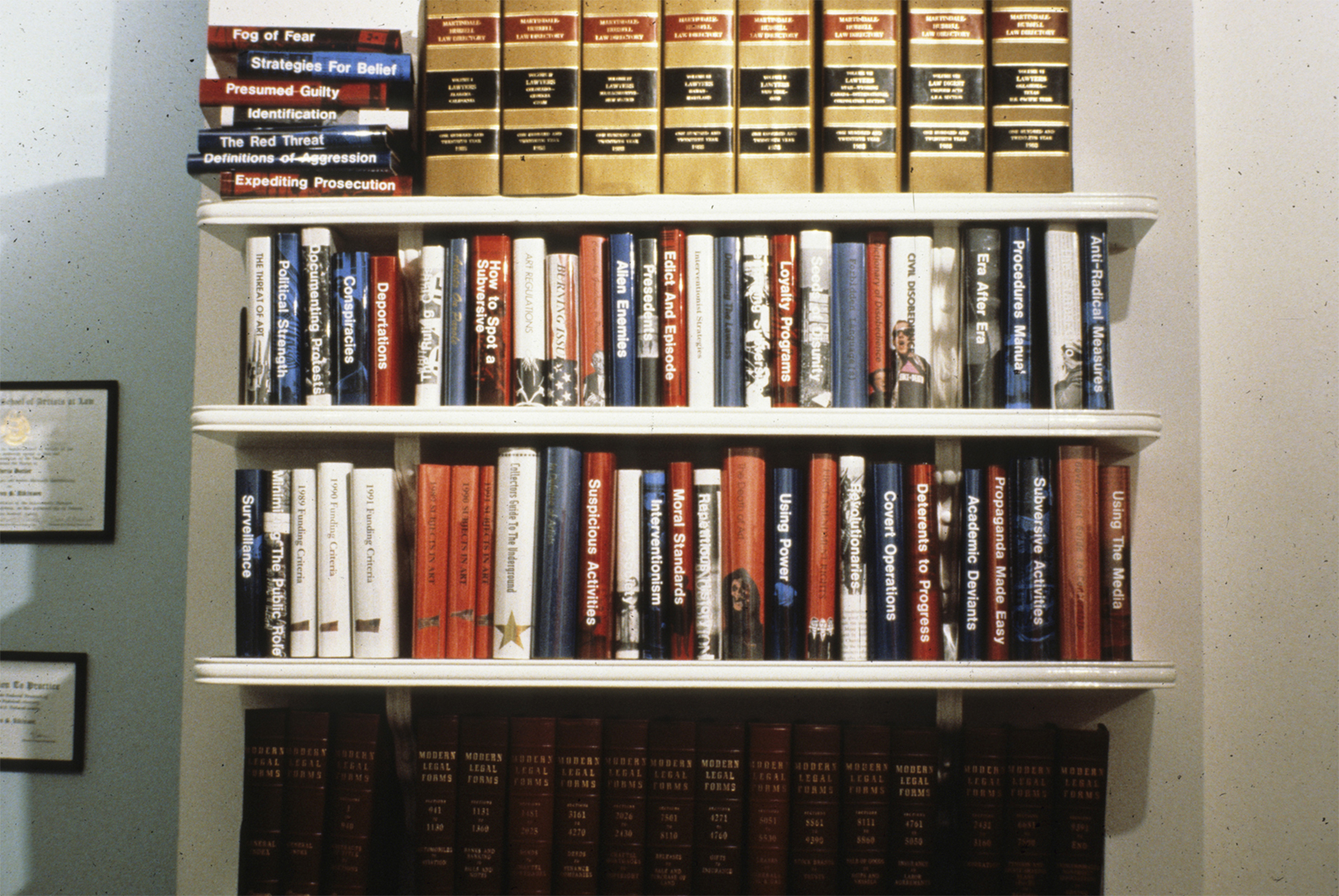 ART PROTECTION SERVICES: Karen Atkinson and Associates, ARTtorneys At Work. Law books were borrowed from a local attorney, and other book covers were made that a lawyers office involved in this kind of activities might have on their bookshelves. All in Red, White and Blue of course.