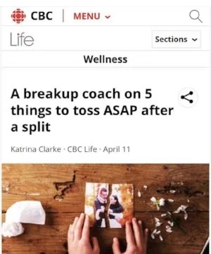 Image of someone’s hands on a photograph of a couple ripped in half.