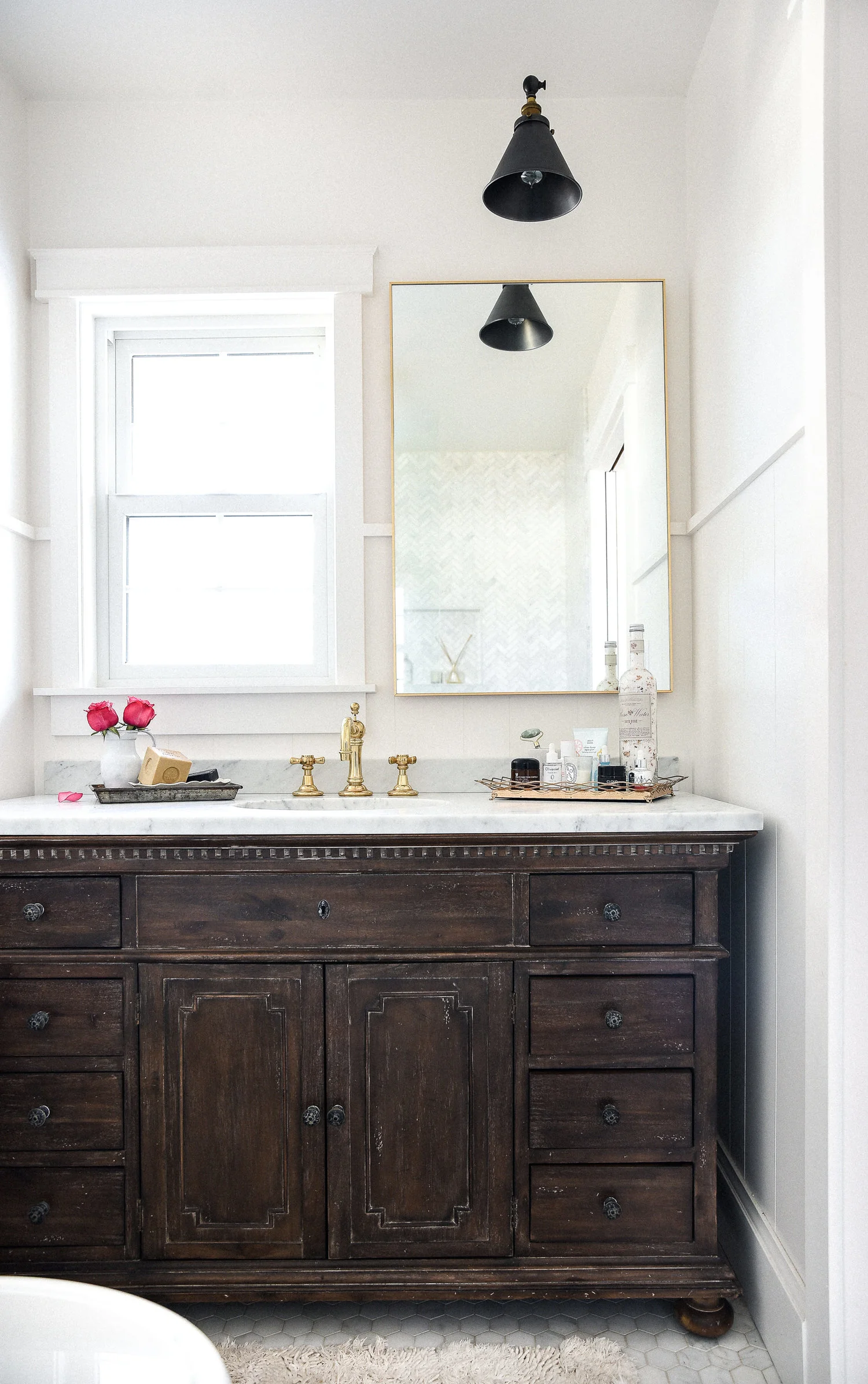 Marble+&+brass+bathroom+with+vintage+dark+wood+vanity+remodel.jpeg