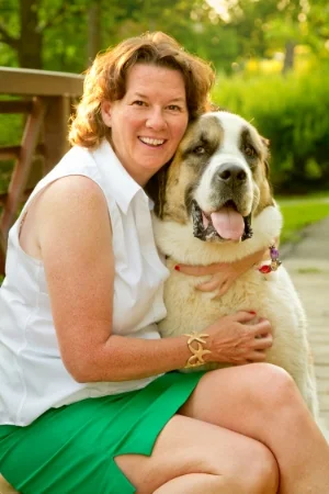 Pillow is a goofy 145lbs St. Bernard/Great Pyrenees cross. She has a loyal following on Sue's Facebook and Instagram pages, and happily accepts hugs and treats on her daily walks.