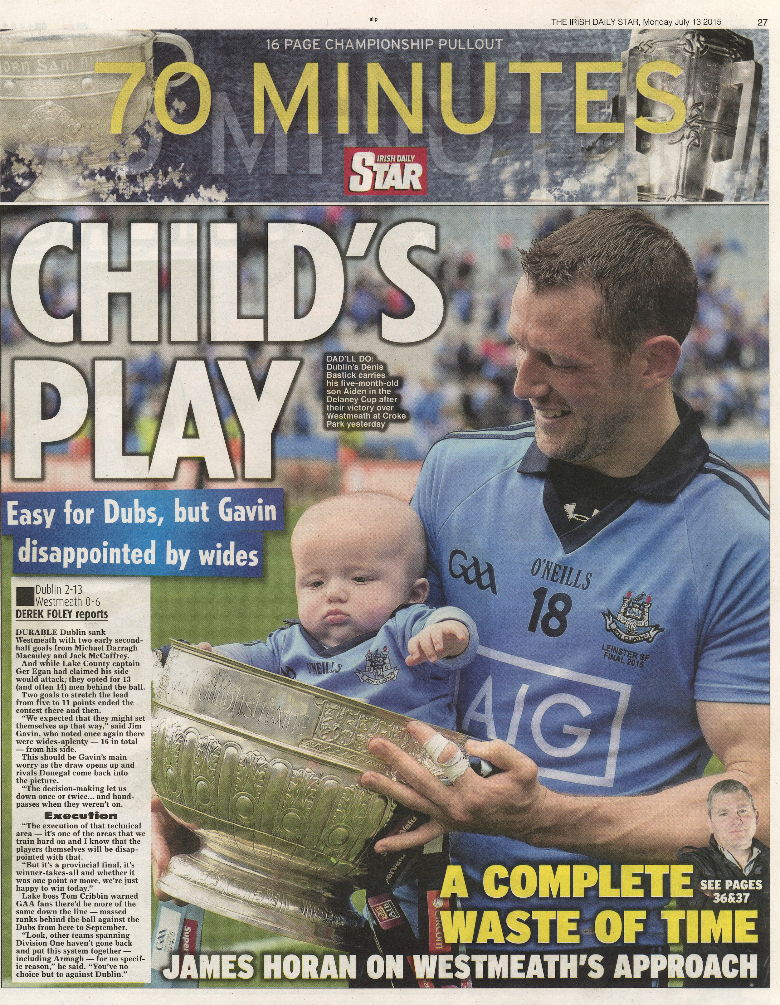  Denis Bastick of Dublin celebrates with his newborn son Aiden and the Delaney Cup after League Championship over Westmeath in Croke Park July 13 2015 /  Irish Daily Star  