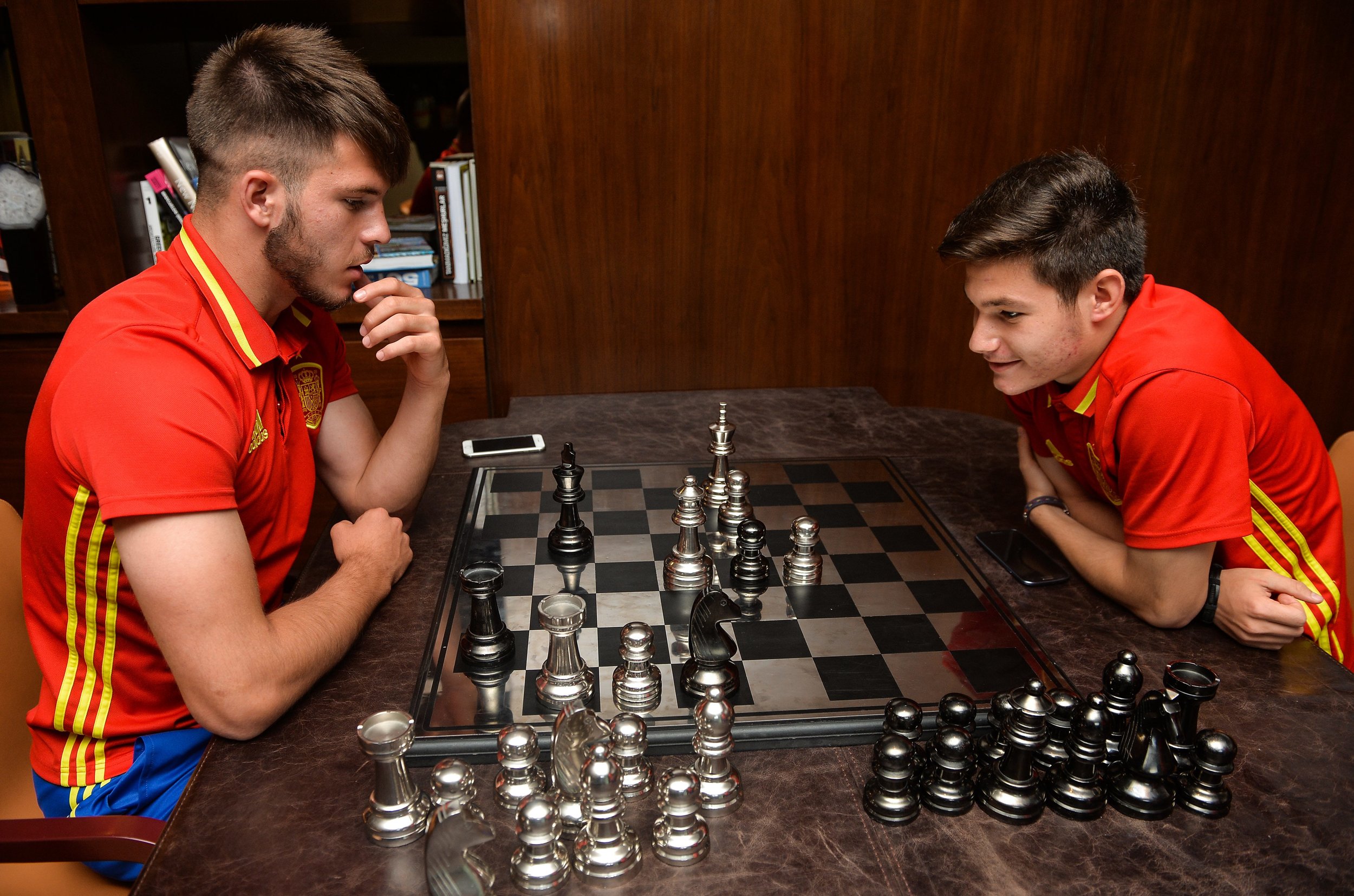  Spain team-mates strategize over some chess before their final against Portugal in Azerbaijan 2016 /  UEFA / Sportsfile  