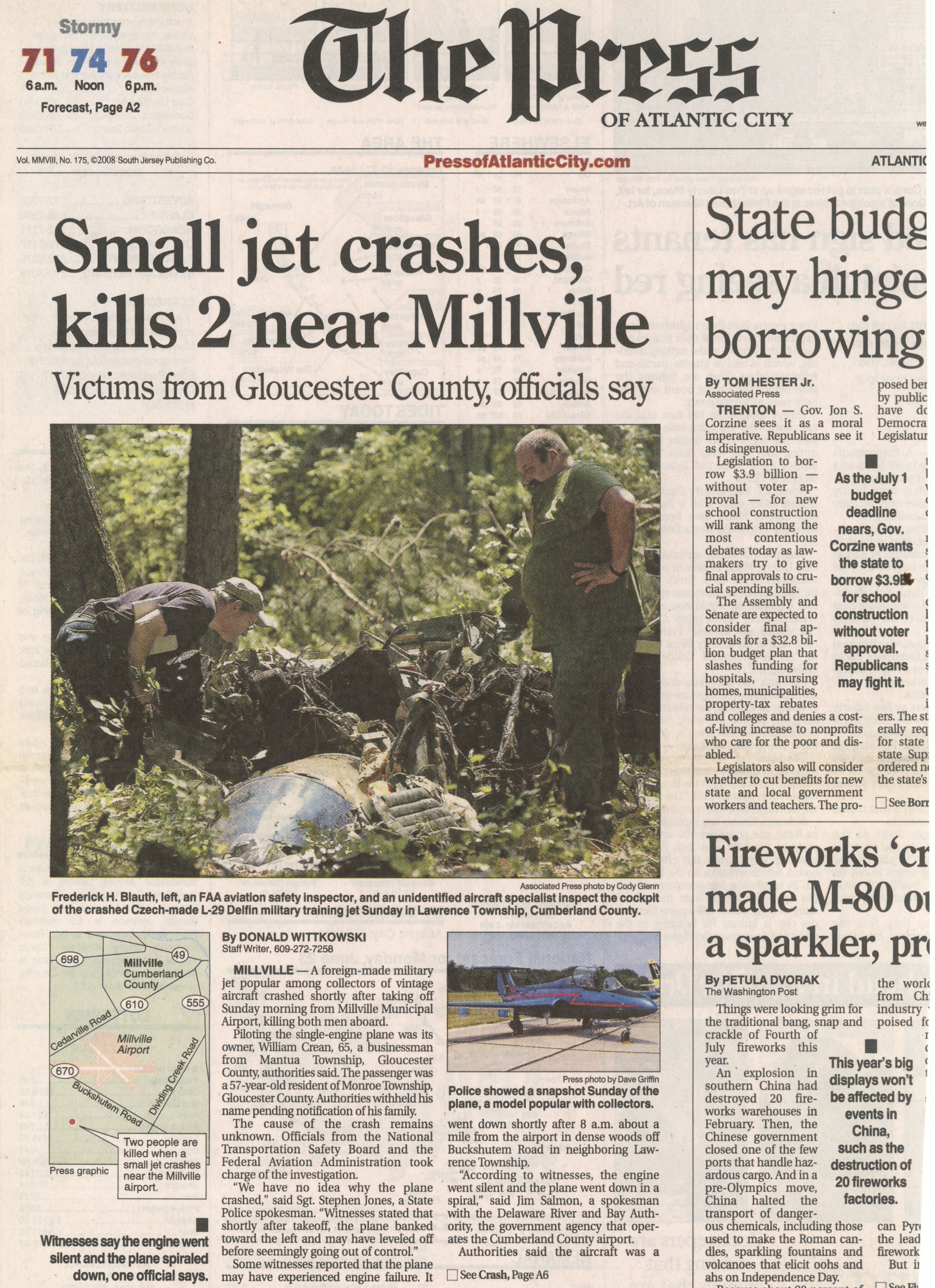  Officials examine the wreckage after a fatal plane crash in Millville, NJ June 22 2008 /  The Press of Atlantic City  