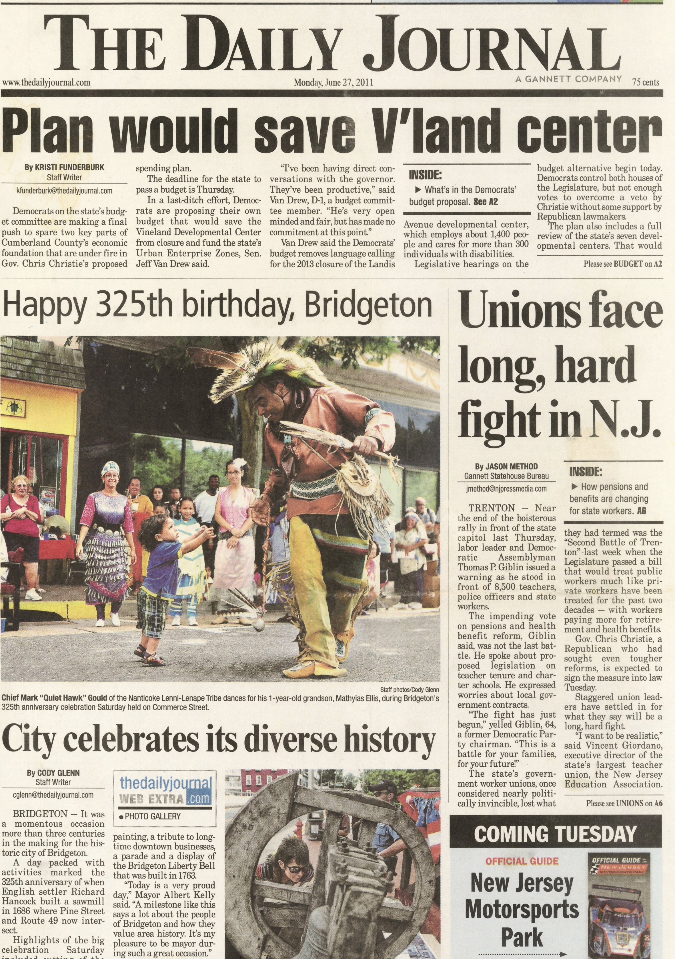  Nanticoke Lenni-Lenape Chief Mark "Quiet Hawk" Gould dances with one-year-old grandson Matthyis in the streets during the City of Bridgeton, New Jersey 325th anniversary celebration June 27 2011 /  The Daily Journal  