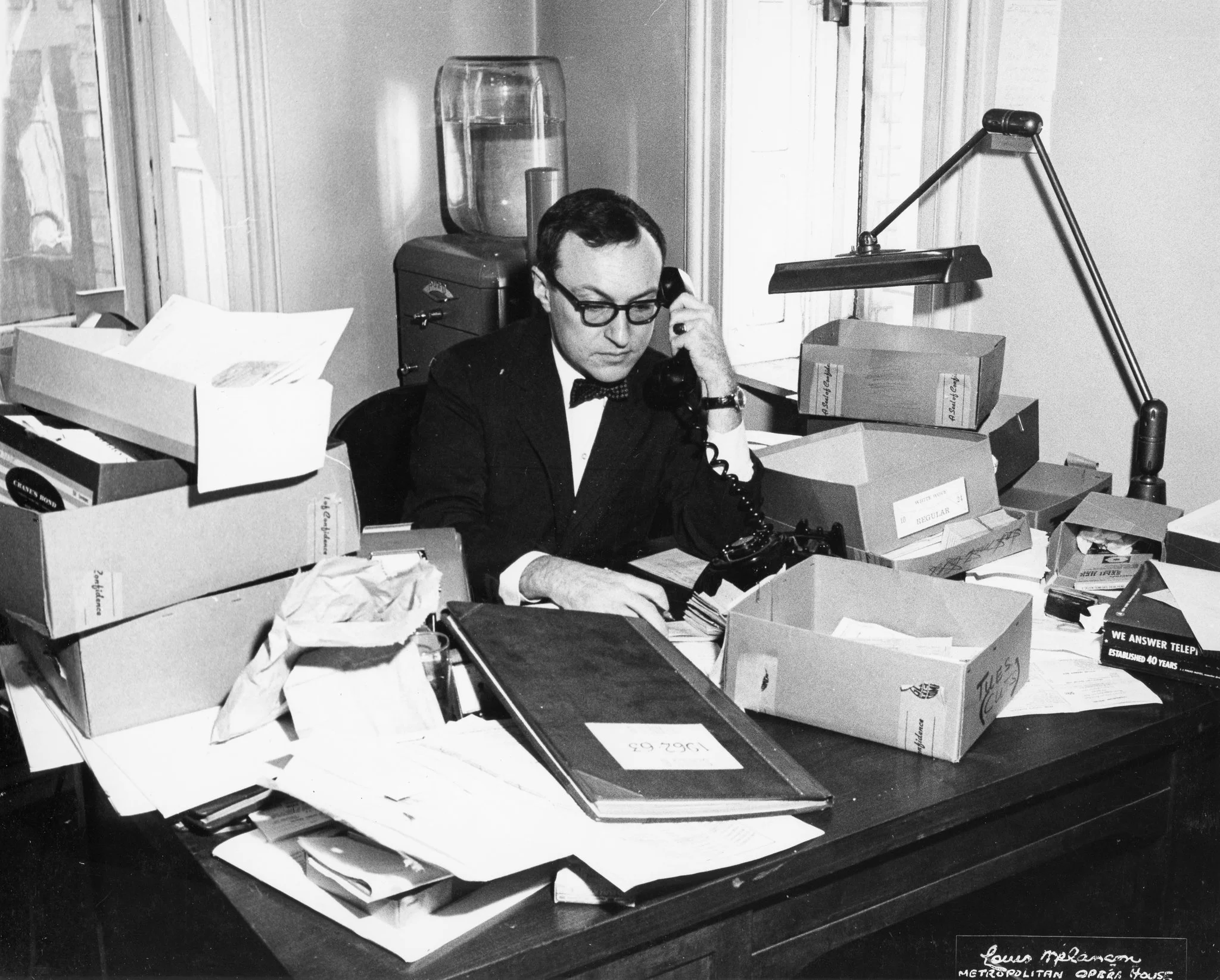 Alfred Hubay at work in the 1960s. His long career as an usher, house manager and box office chief gave him the ability to predict houses with uncanny precision. Credit Louis Melancon/The Metropolitan Opera