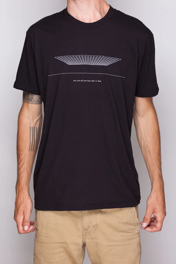 White print on Black Next Level Apparel shirt.