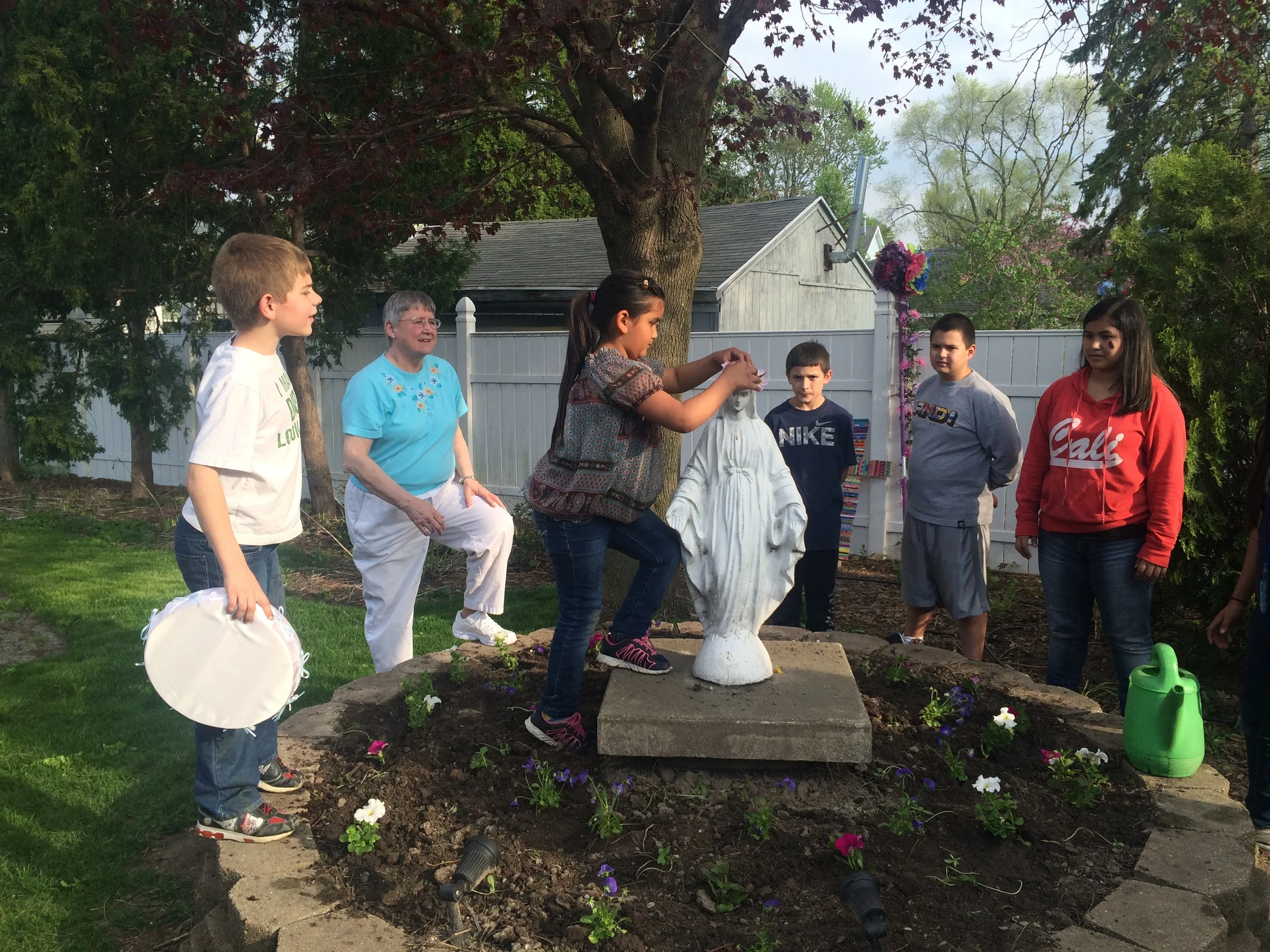 One of our youngest students crowning Mary.