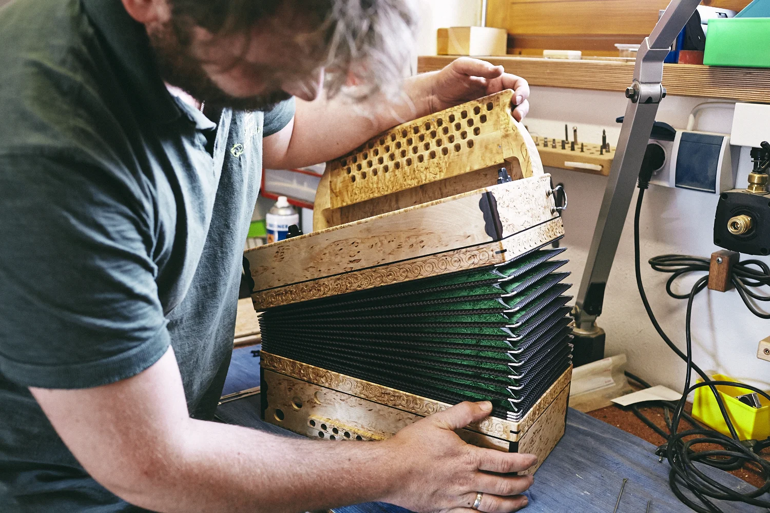 Documentary and portraits of a young craftsman producing accordions