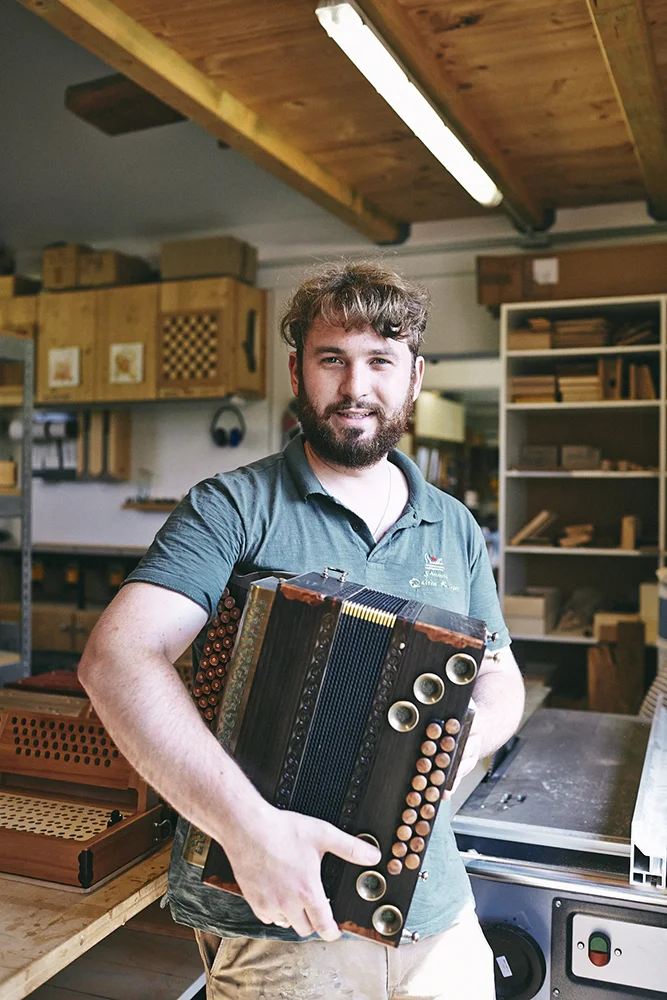 Documentary and portraits of a young craftsman producing accordions