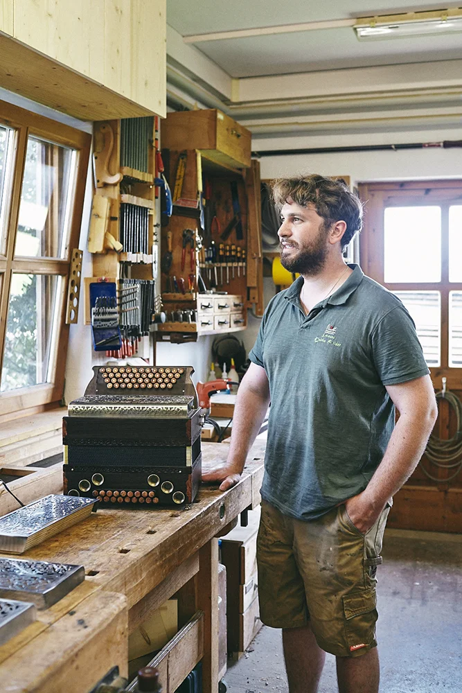 Documentary and portraits of a young craftsman producing accordions