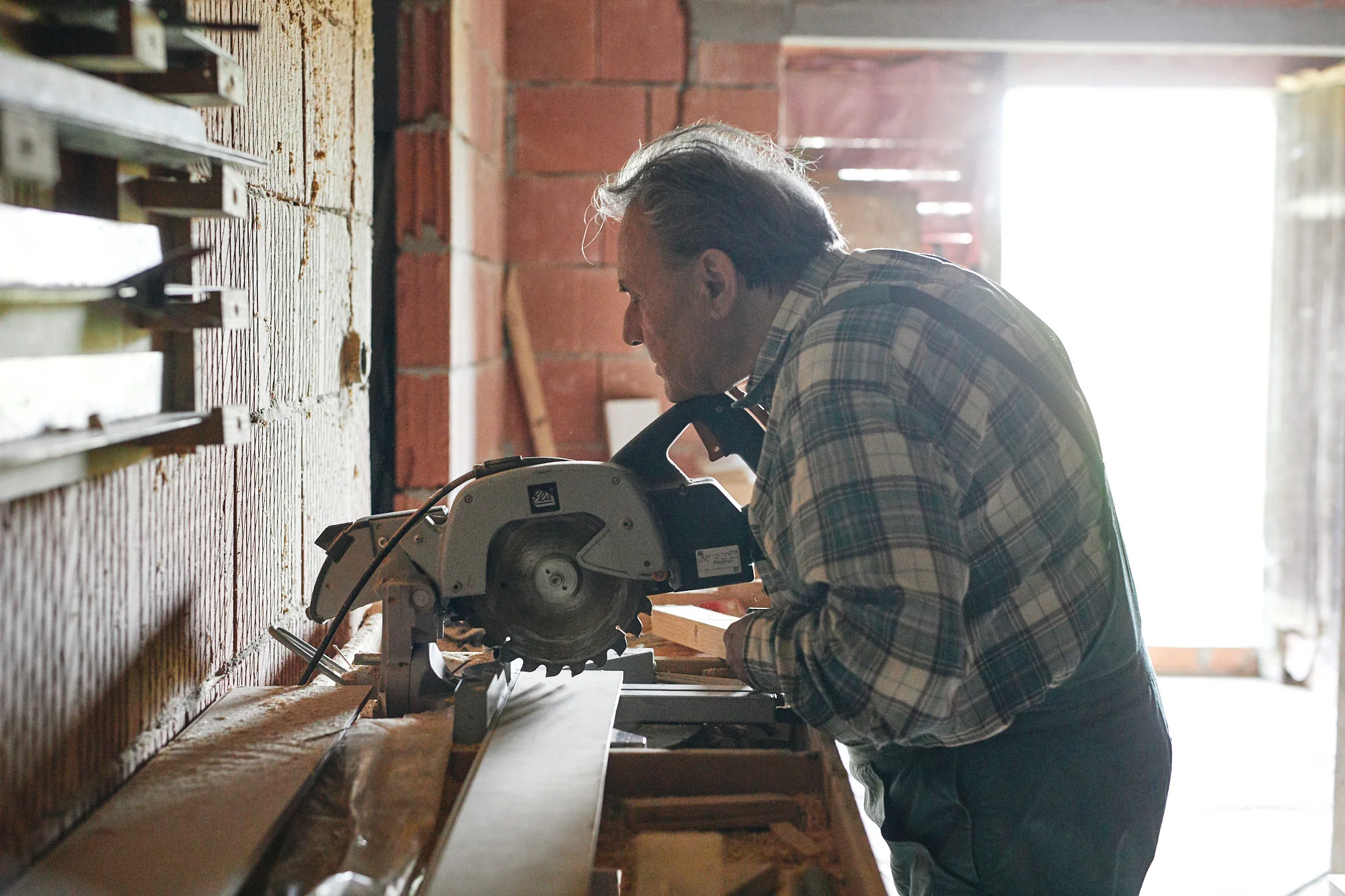 A blind man building his own house