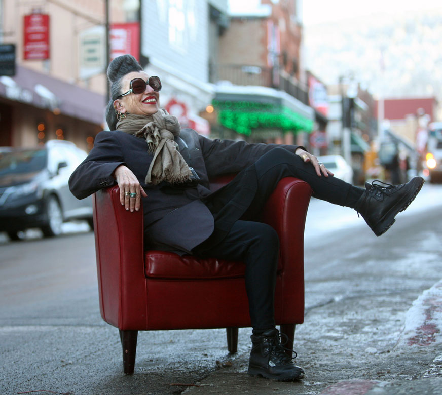 Photographer Henny Garfunkel poses for a photograph on Main Street in Park City, Utah, before the start of the Sundance Film Festival. Garfunkel has been photographing film festivals since 1993. Kristin Murphy for The New York Times