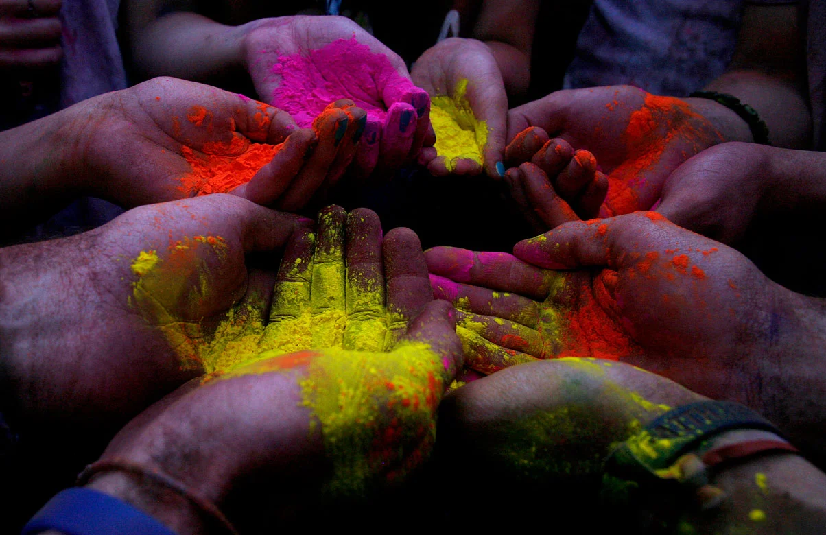 Festival goers prepare for the final throwing of the colors on Saturday during the Holi Festival of Colors at the Sri Sri Radha Krishna Temple in Spanish Fork on March 24, 2012.