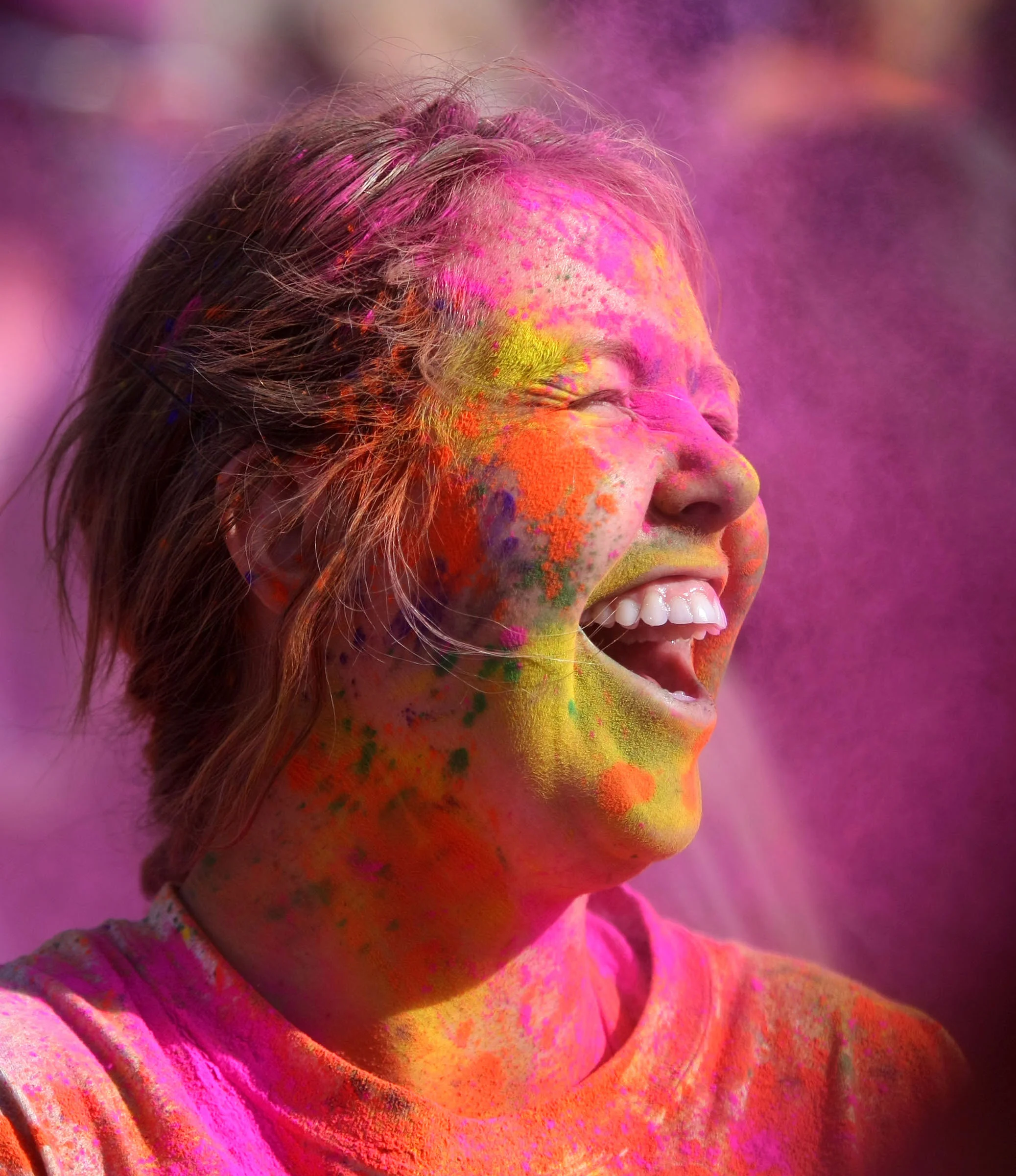 Ali Ball gets sprayed with chalk at the Holi Festival of Colors at the Krishna Temple in Spanish Fork on Saturday, March 30, 2013.