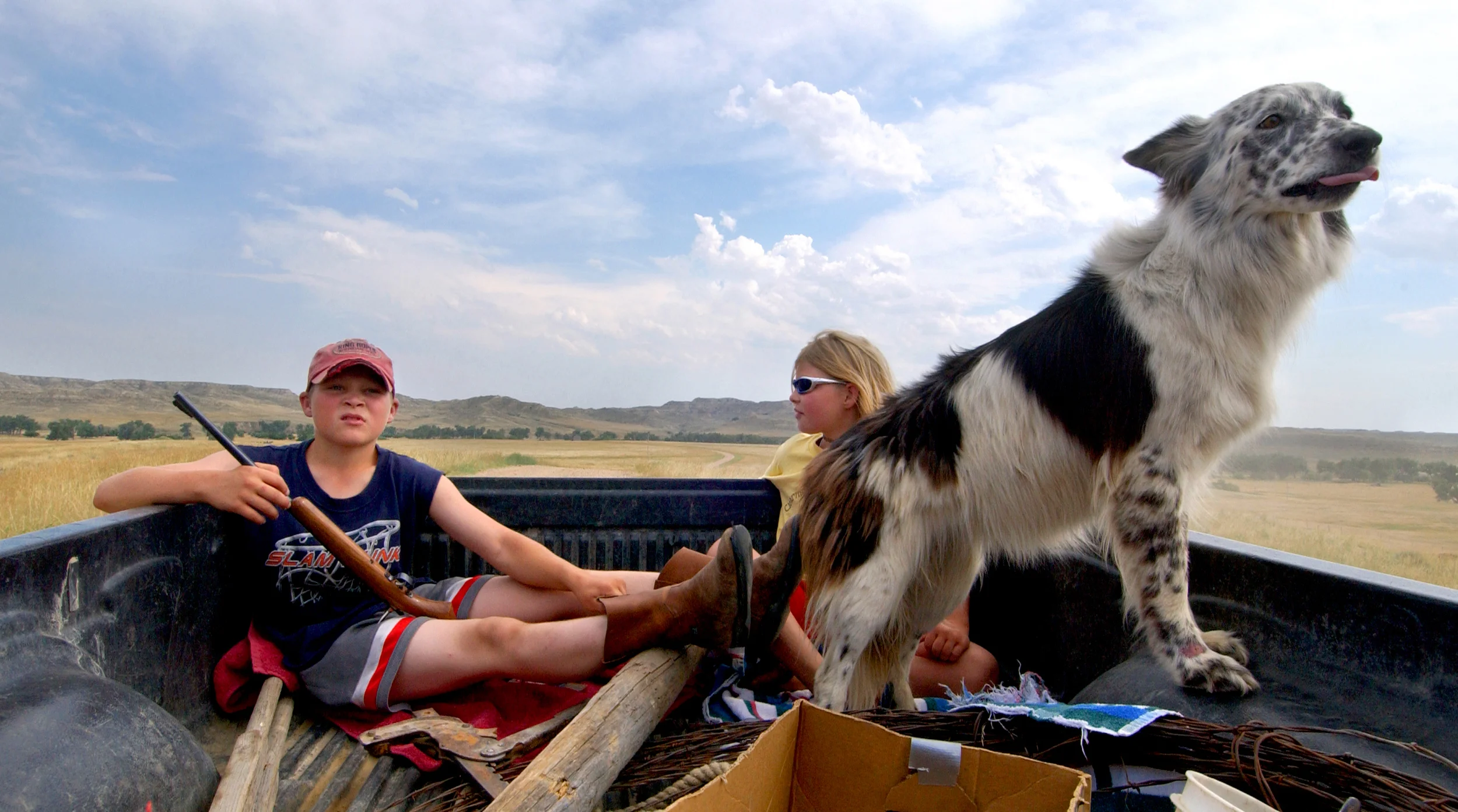  "It's a full-time job looking after all this methane. You don't dare leave." - Ken Clabaugh, ranch owner  Mason Rockafellow, 11, Hannah Rockafellow, 8, and their dog Mandy ride in the back of their grandfather's pick-up truck as he tracks down an un