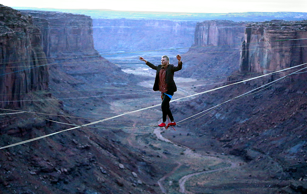R.J. Roush highlines across the Fruit Bowl, near Canyonlands National Park and Moab, Utah on Monday, Nov. 20, 2017.