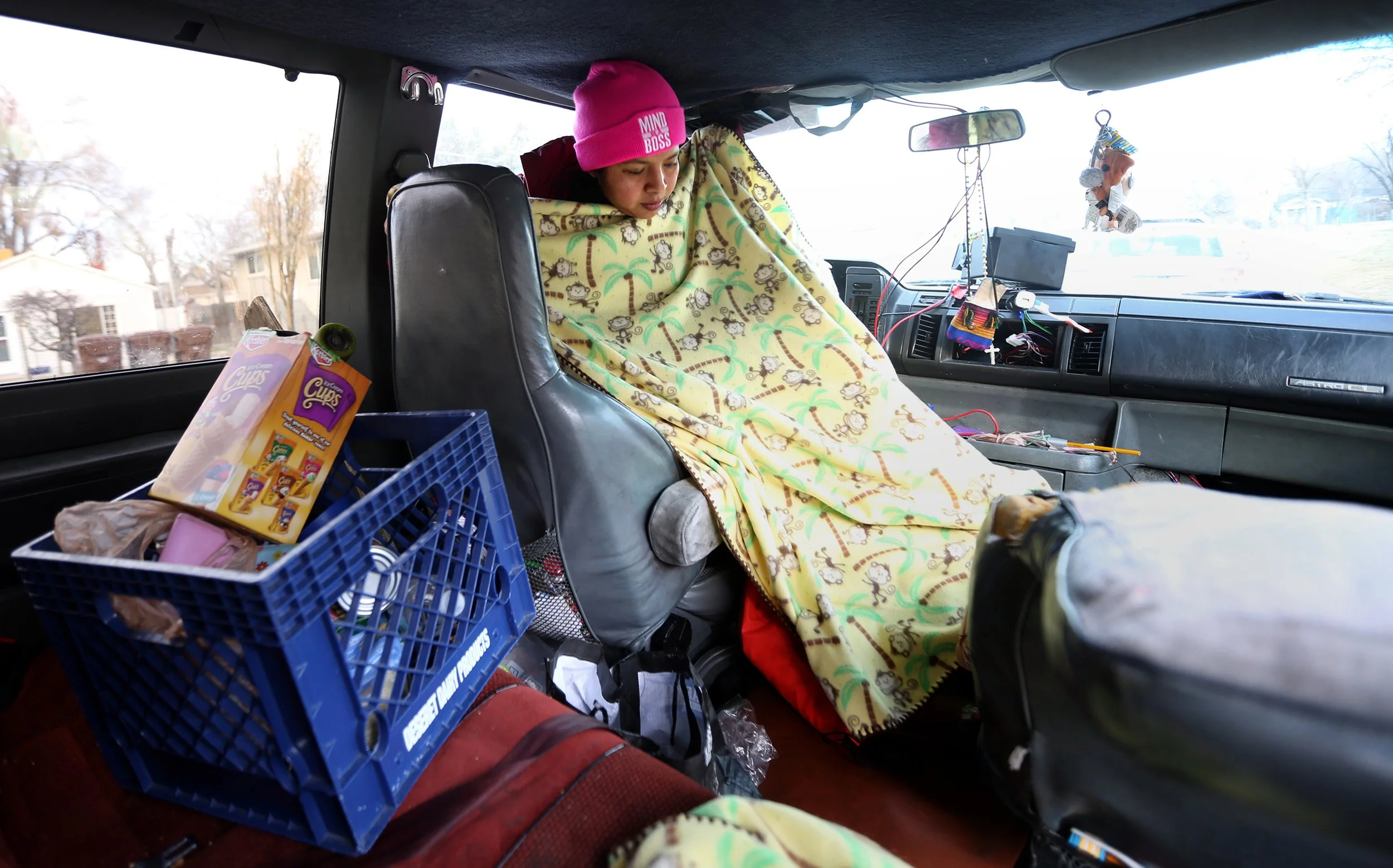  Marcell Chilel sits in the front seat of her van outside Granite Park Junior High School in South Salt Lake on Thursday, Jan. 4, 2018. Chilel and her five children lived out of the van for months until checking into a homeless shelter on Dec. 26. Th