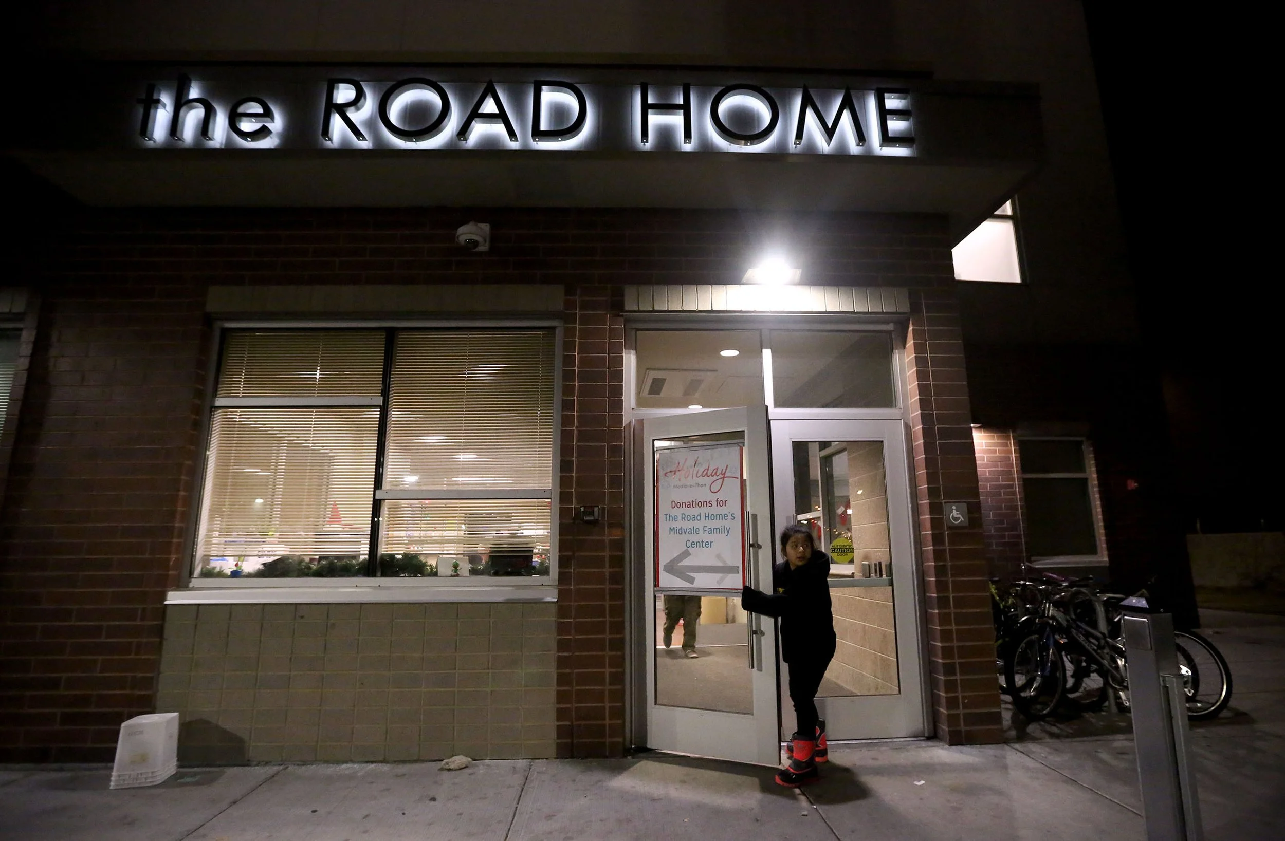  Joselyn Hernandez Chilel looks back at her family as they check into the Road Home family shelter in Midvale on Tuesday, Dec. 26, 2017. The family had been living out of a van. 