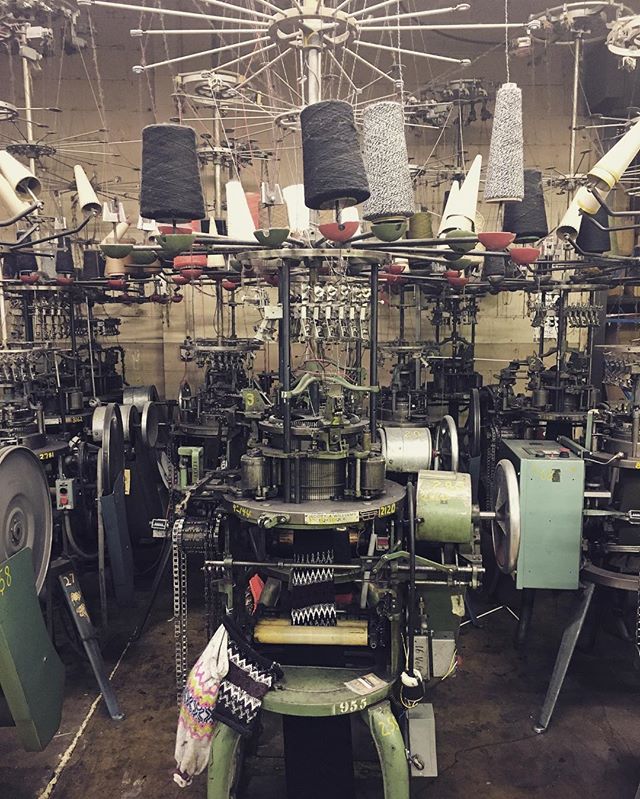 Checking in on our winter 2017 beanie line today at the manufacturer in western NJ... USA made knit caps are spun through these old-fashioned contraptions, programmed entirely by hand simply by adjusting needle counts, a series of chains, and colored