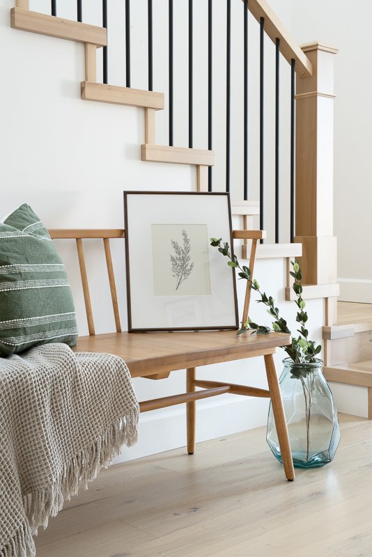 Product Photography & Interior Photography of fine art prints in a bright entrance with a styled bench