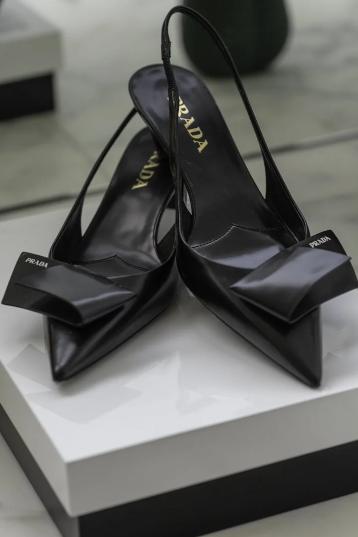 product photography of Prada shoes in a luxury closet