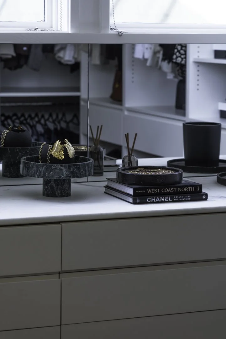 product photography, jewelry photography and interior photography of a beautiful gold bracelet styled in a luxury walk-in closet