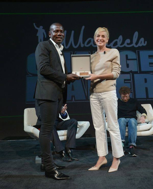 Sharon Stone accepting the Changemaker Award from Kweku Mandela