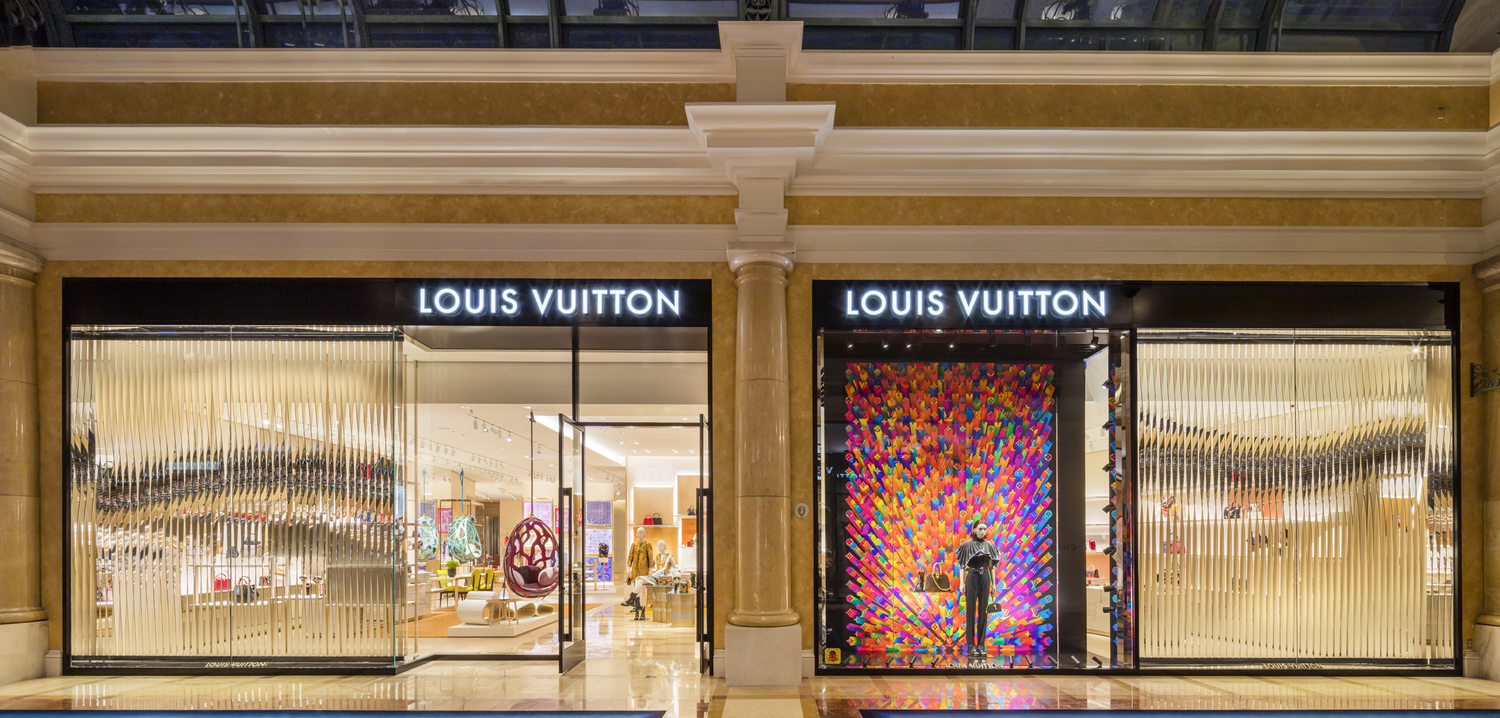 Tourists walk past a Louis Vuitton shop at the Bellagio hotel and News  Photo - Getty Images