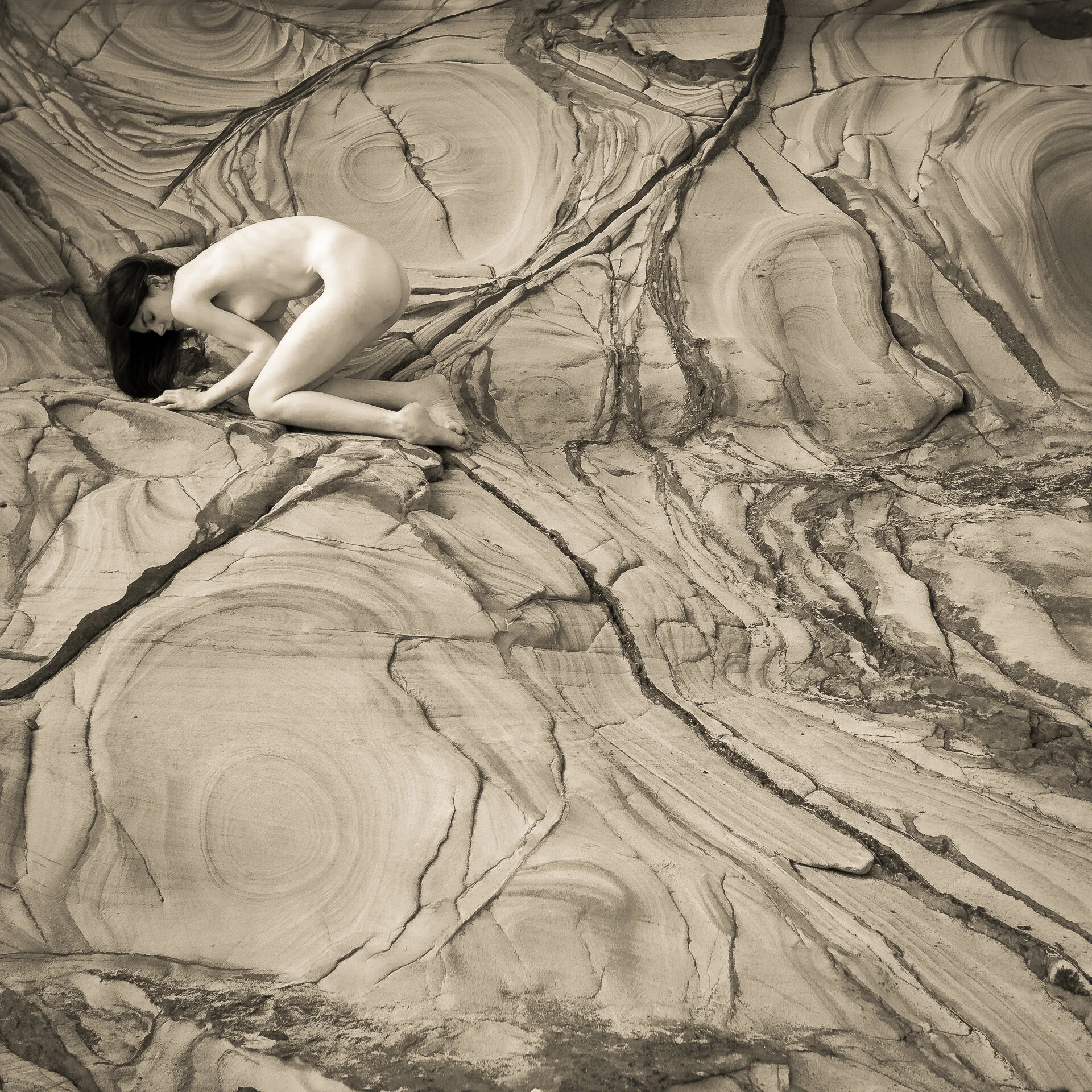 Rheia watches - Rheia is the mother of the gods. Here she is watching over the flow of time in her rock. From the Flesh and Stone Series.
