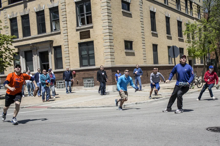 Fans shag balls during batting practice on Waveland Avenue. Dave Davison, second to the right, has collected more than 5000 balls in more than 20 years. 
