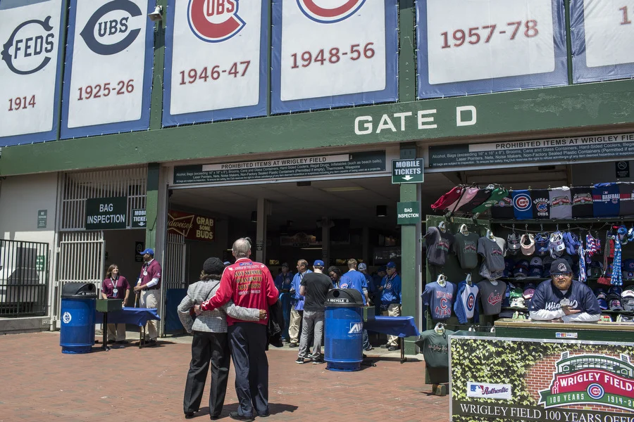Bora Bora Bill and Mae Merrill embrace as they look inside Wrigley Field. 