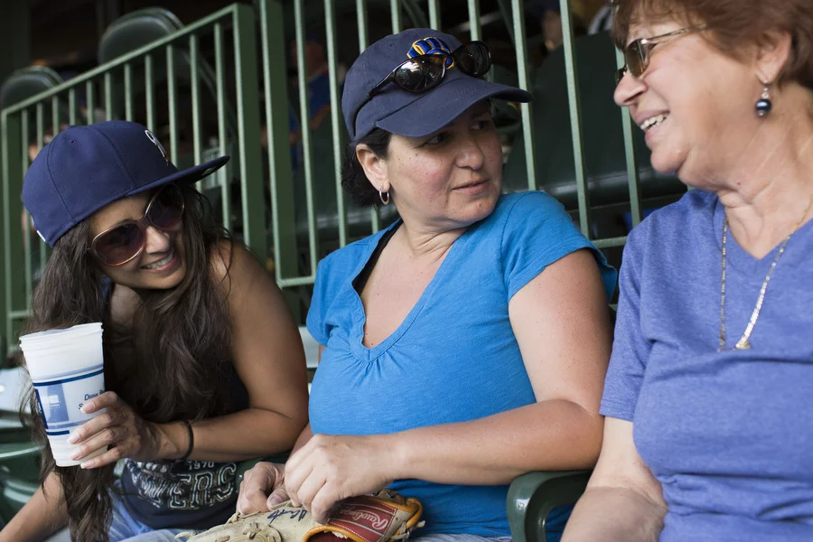 Three generations of Brewers fans: From left, Mayra, Estela and Natalie. Their husbands all left the game early. 