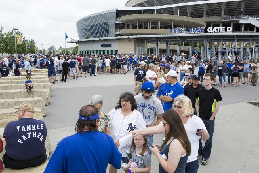 Fans wait to get into the game at Gate D.