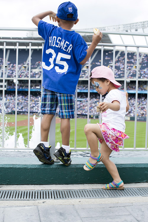 Thomas, 6, and Sophia Smith, 3, enjoy the outfield concourse before the game. 