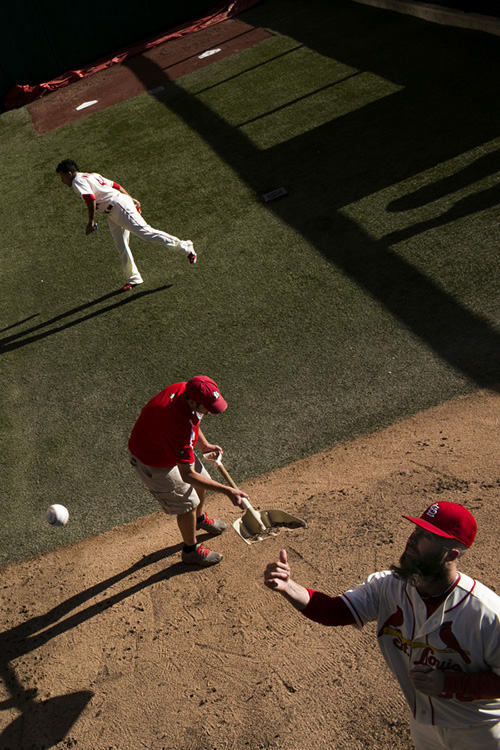 Reliever Jason Motte tosses a ball to a fan. 