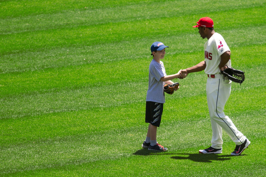 Right before the game, Indians centerfielder Michael Bourn met a student who participated in the High Achievers Kids Club program. 