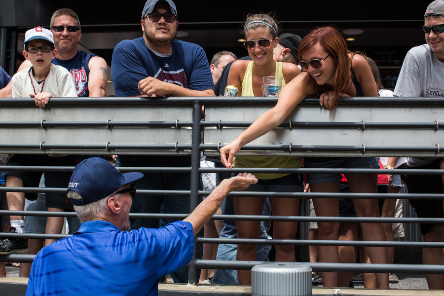 Usher Richard collects aluminum beer can tops from fans during the game. He collects hundreds of them per game and then donates them to the Aluminum Cans for Burned Children Foundation. "I've been collecting tickets and everyone's situated so now I'm starting to collect can tops," he said.