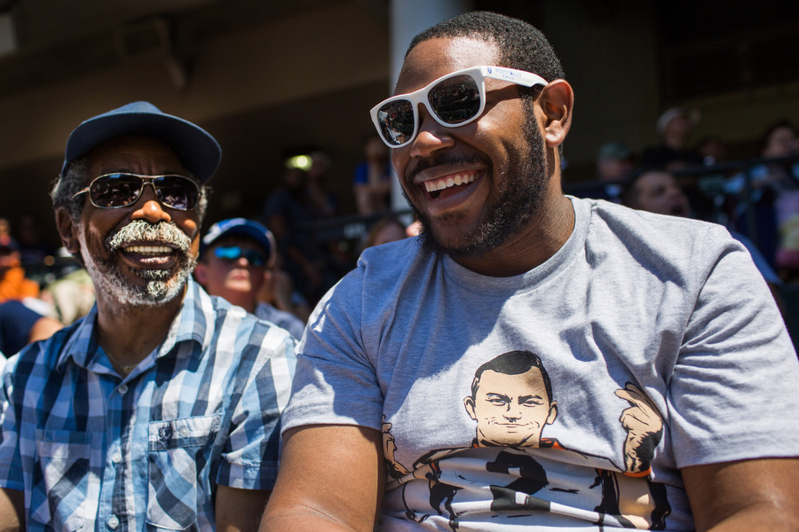 Don, left, and his son Reggie share a laugh during the game. During the top half of the fifth inning that lasted almost half an hour, Don said "Hey! My train leaves tomorrow!"