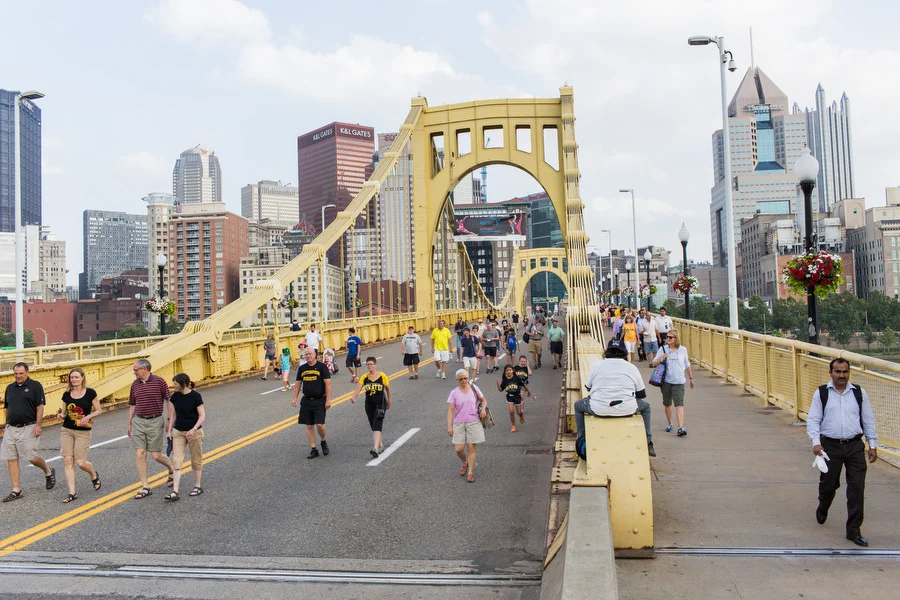 Fans walk over the Roberto Clemente Bridge towards PNC Park.