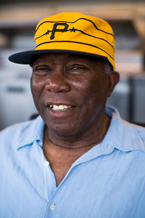 Former Pirates catcher and three-time All-Star Manny Sanguillen owns a barbecue stand in left field. He signs autographs and poses for pictures with fans during the games. 