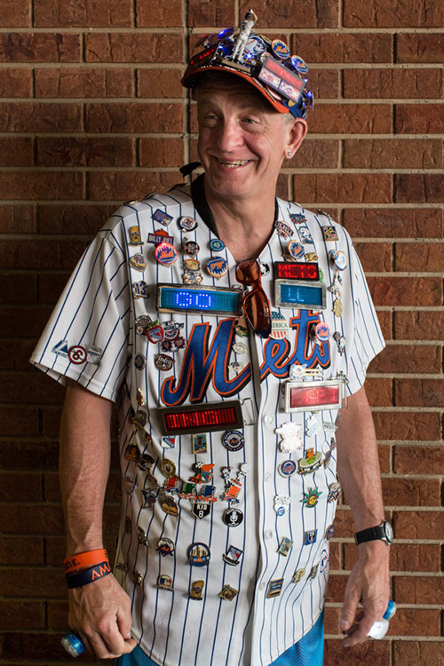 Nick Giampietro, known better as "Pin Man," wears a jersey with more than 100 pins on it whenever he goes to a game. He has season tickets and comes to almost every Mets home game. He works in a deli as his daytime job. 
