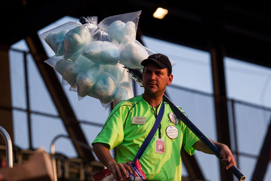 Vendor Peter Tehomillic sells cotton candy and cracker jacks in the upper deck. 