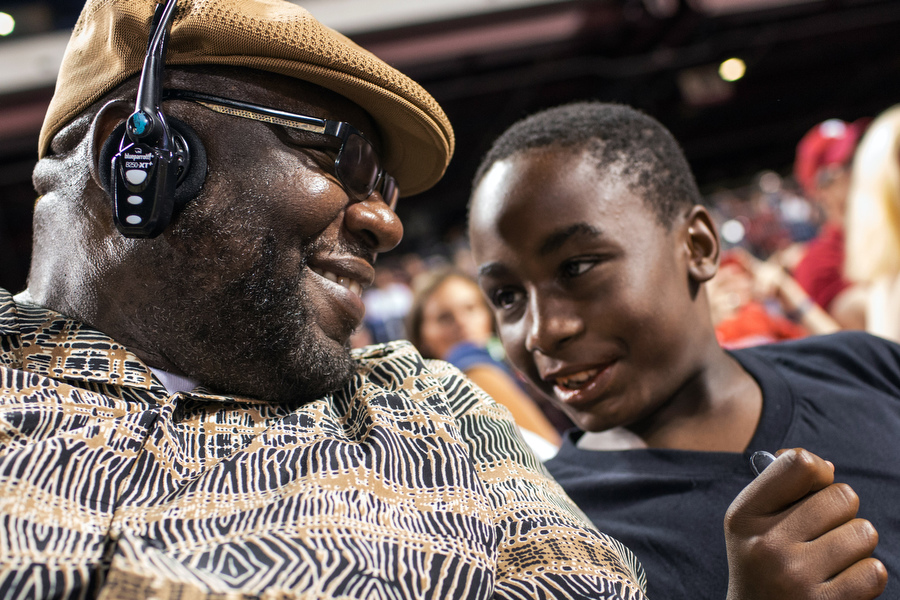 Wayne, a 23-year Marine veteran, attended his second ball game ever and his nephew Dashon attended his first. "It's the only place that you can act like a kid and nobody will care," Wayne said. 