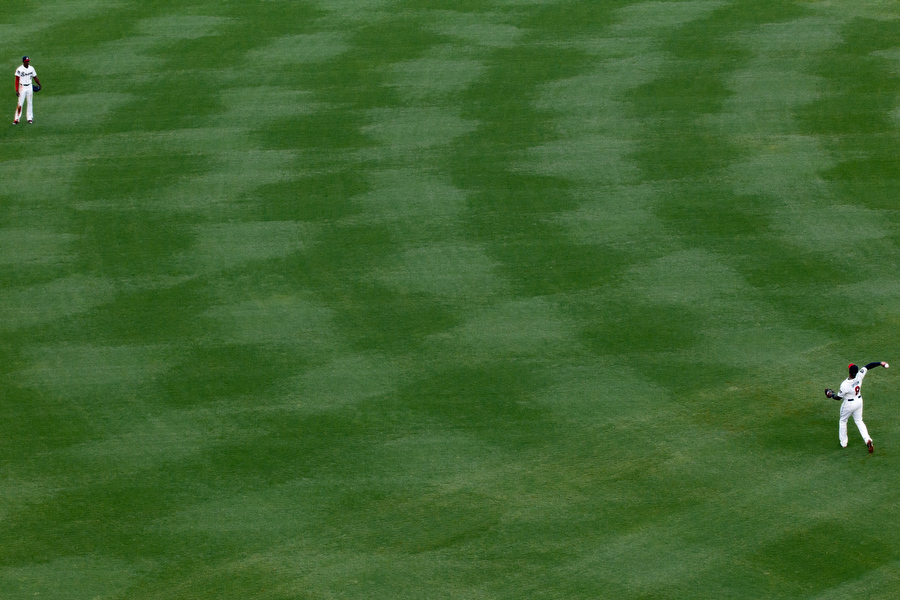 Brothers B.J. and Justin Upton play catch in the outfield. They are currently the only brothers playing on the same team in M.L.B. Before playing for the Braves, they had never played on the same team. 