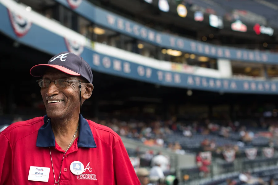 Walter Banks has been an usher for the Braves for 49 years. "Gas is what keeps your car moving and great fans are what keep me moving," he said. The first game he worked was on April 12, 1966. Baseball "brings people together," he said. "All races, all classes, all salaries."