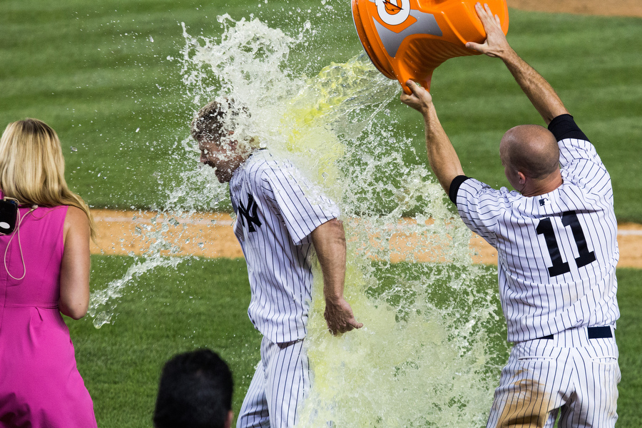 Chase Headley gets doused in Gatorade after hitting a walk-off single to defeat the Rangers in the 14th inning. 
