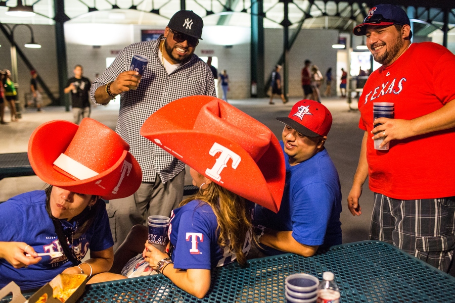 From left, Jessica, Tom, Linda, Turtle and Ray share a laugh on the outfield concourse. 