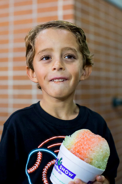 Asher, 7, ordered shaved ice at the game.